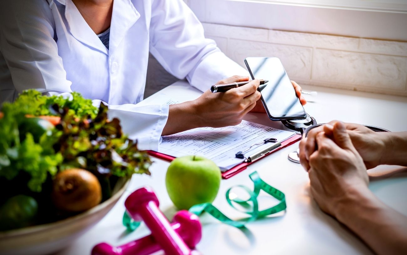 A nutritionist working with a patient.