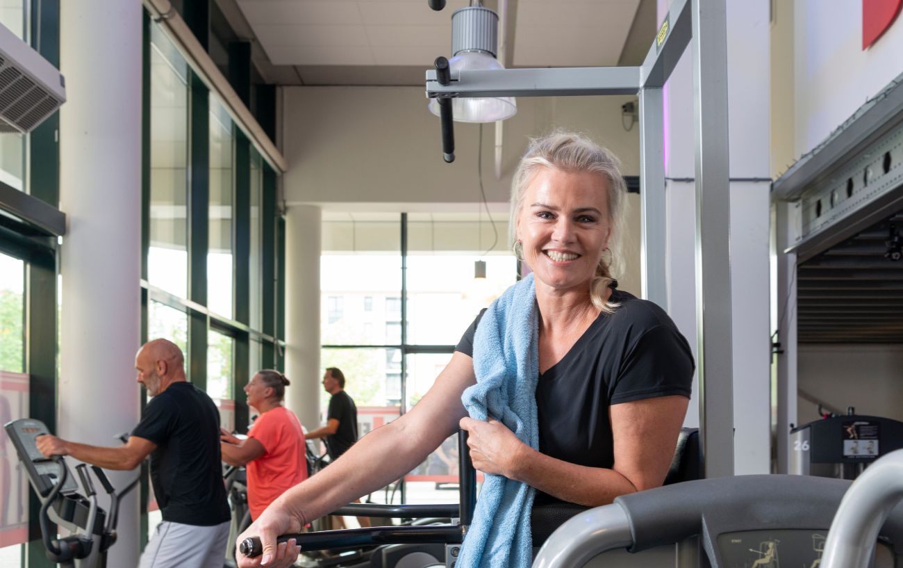 A person smiling at the gym.