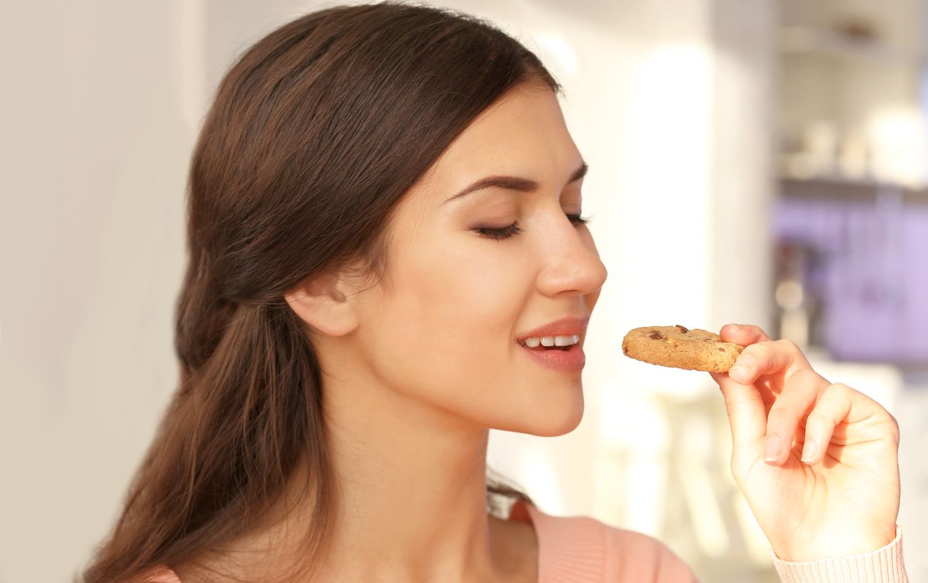 A person eating a cookie.