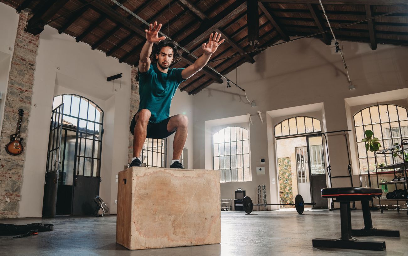 A person doing a box jump.