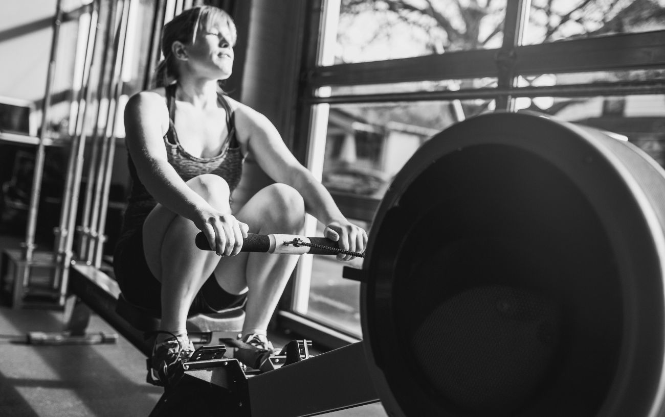 A person on a rowing machine.