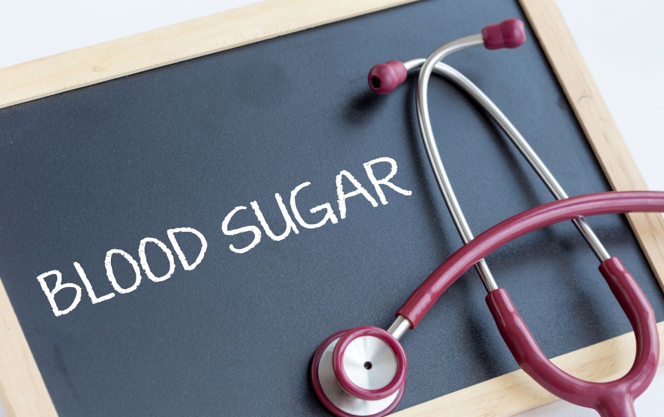 A chalkboard that reads blood sugar, and a stethoscope.